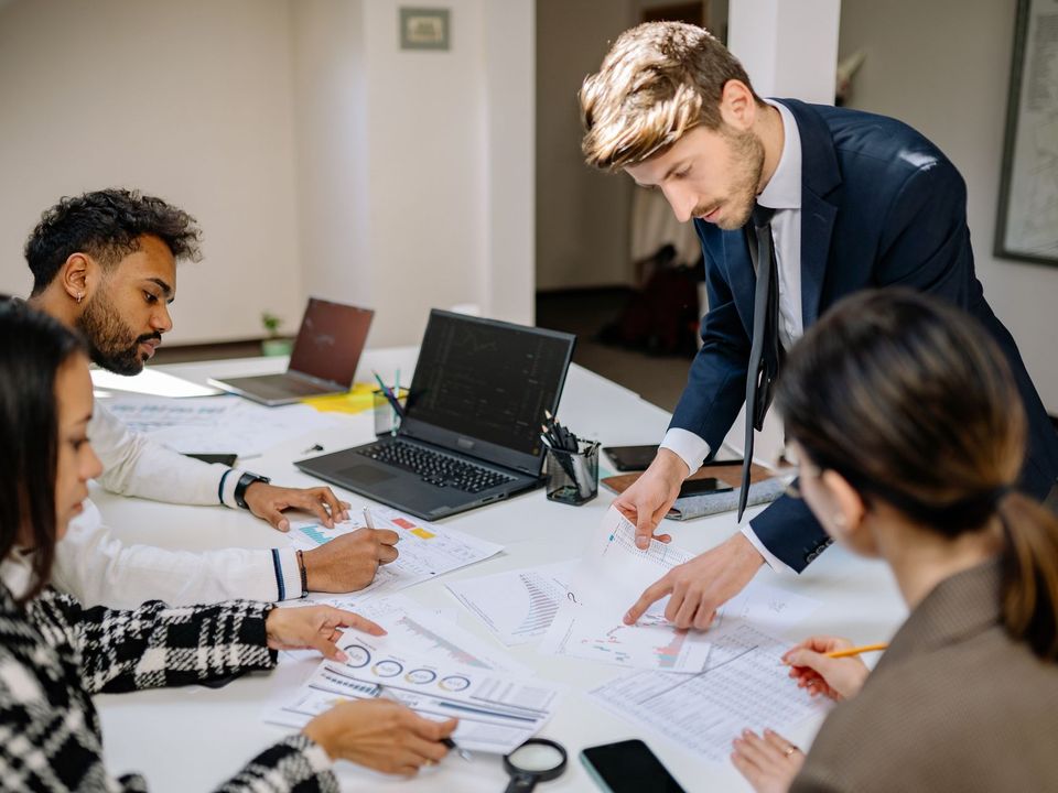 A billing team working at their desks